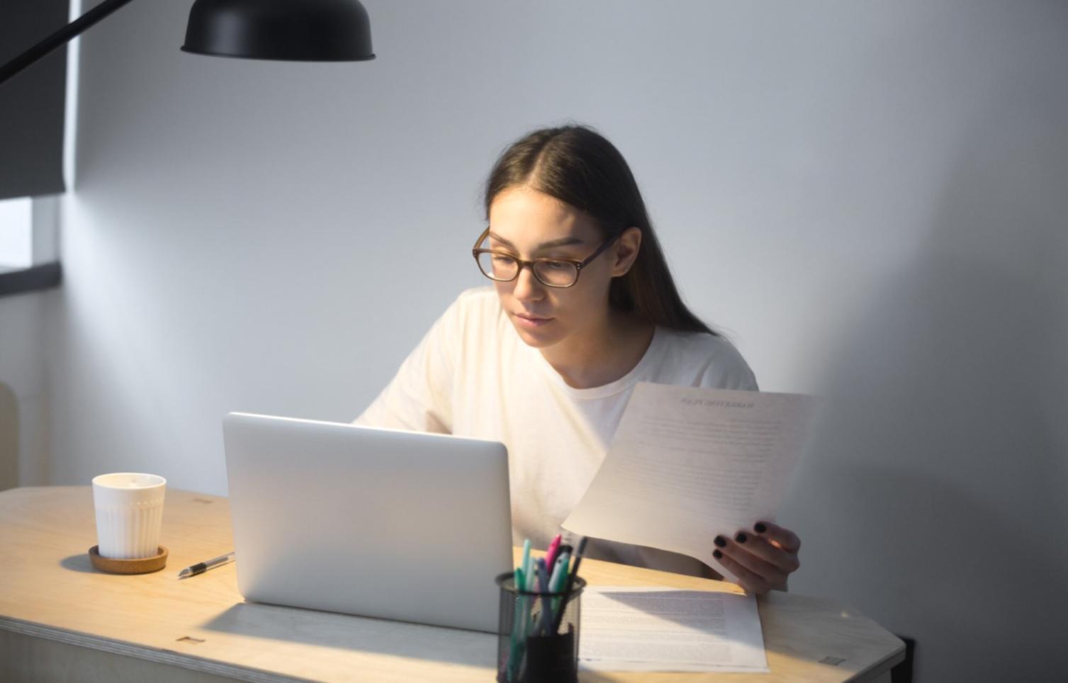 Financial planning workspace with documents and digital tools